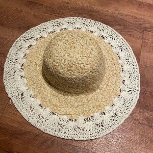 Cute floppy tan hat with white around the edge.